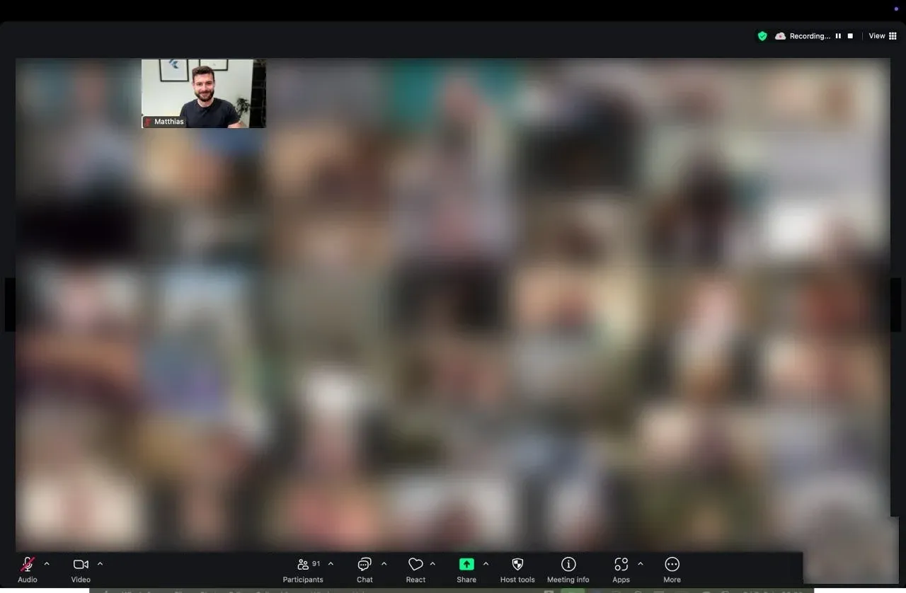Live webinar on Zoom, faces blurred